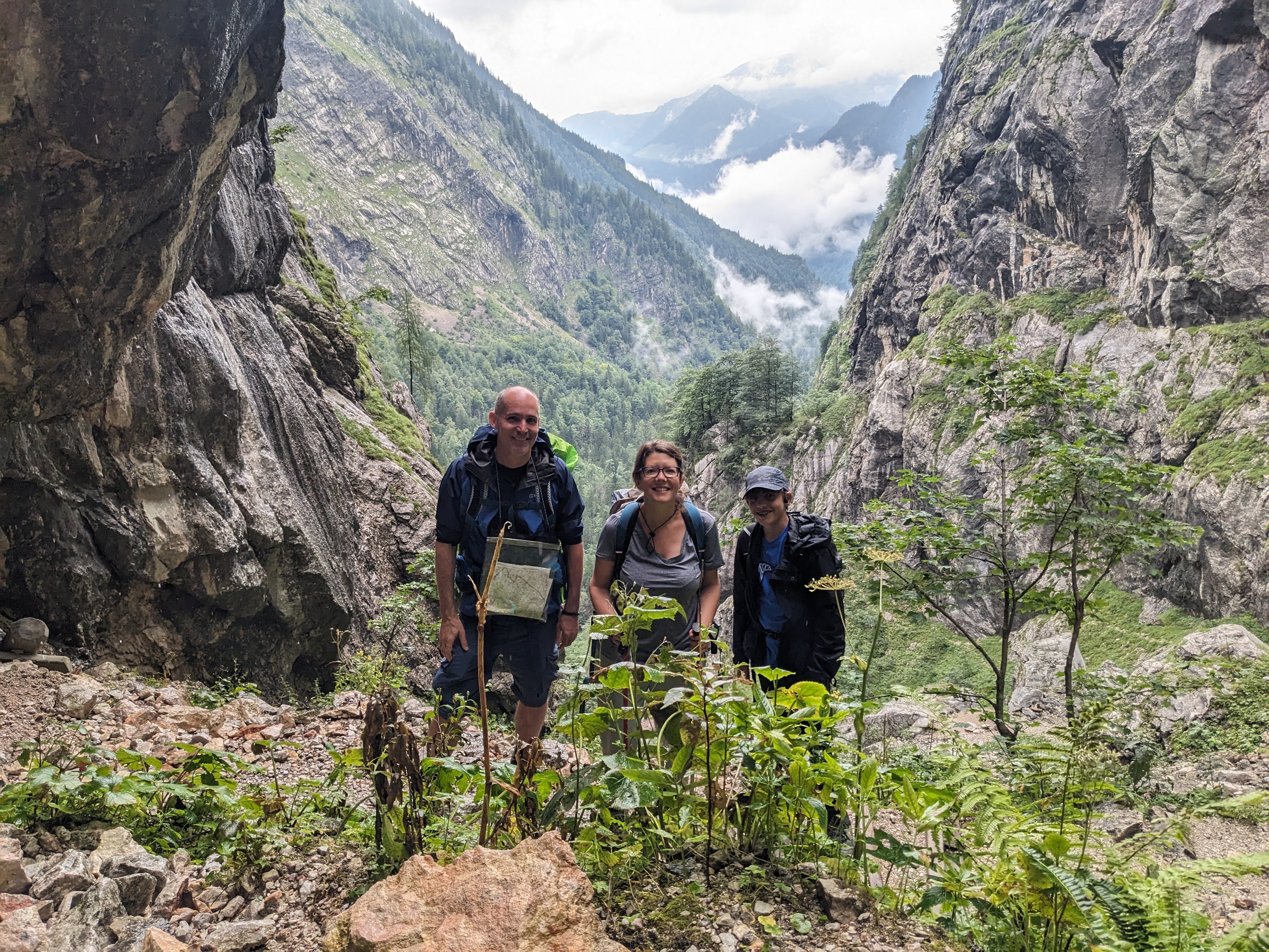 Tom and his parents walking in the German mountains