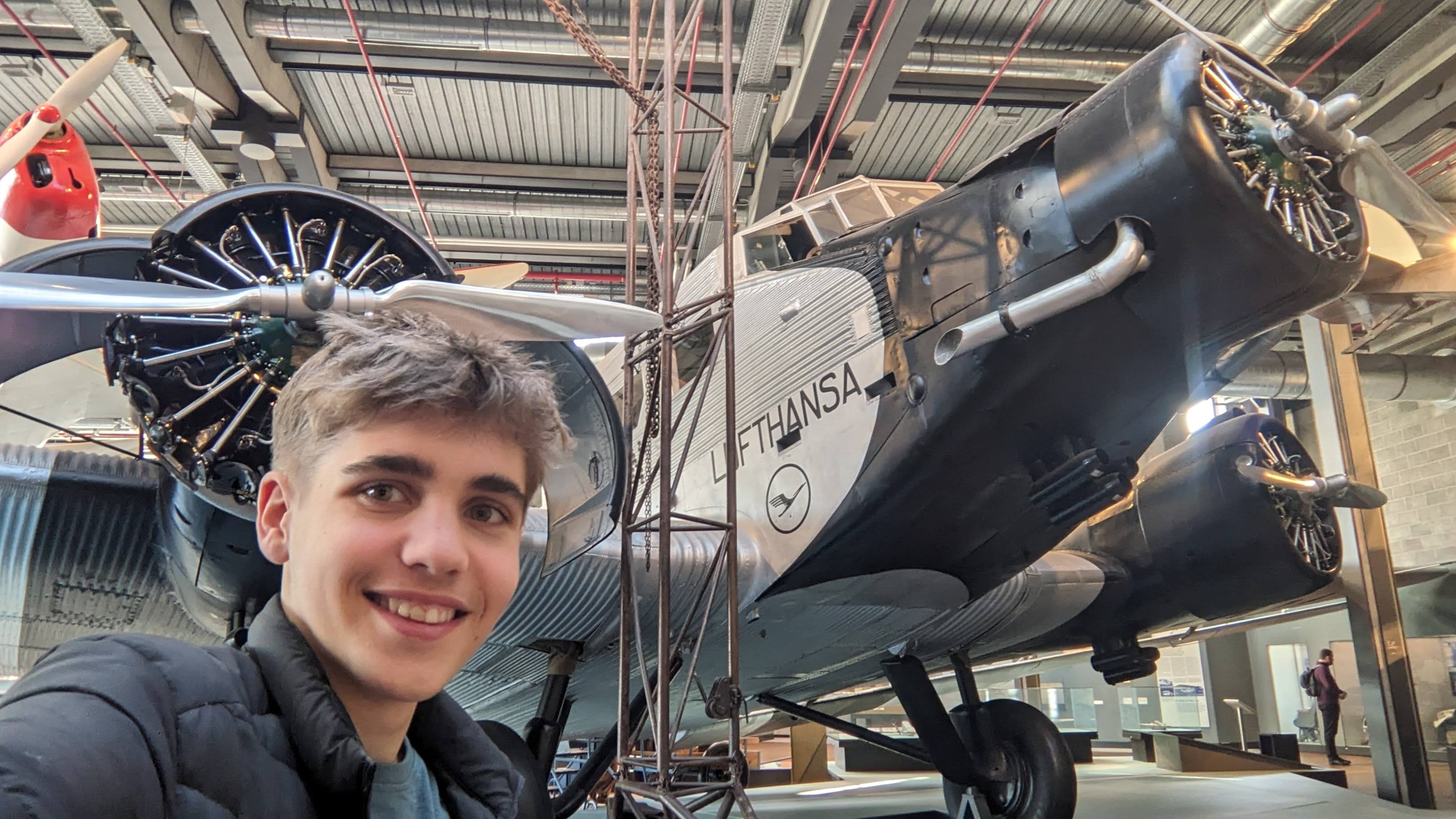 Tom in front of a Lufthansa aircraft at an aviation museum